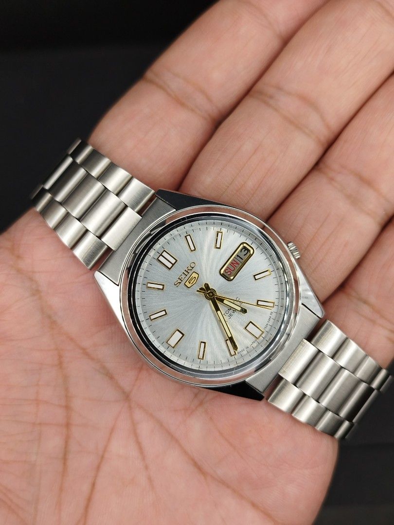 Seiko 5 automatic silver dial (Category: Men's Watches) located in Quezon City. Submitted by ars_watches (Listing ID 1465405274, Image 1). Description: original Seiko 7009 movement bnew aftermarket stainless steel base dial hands and strap in good running condition newly overhauled and oiled movement 37mm case dm with box and paper bag.