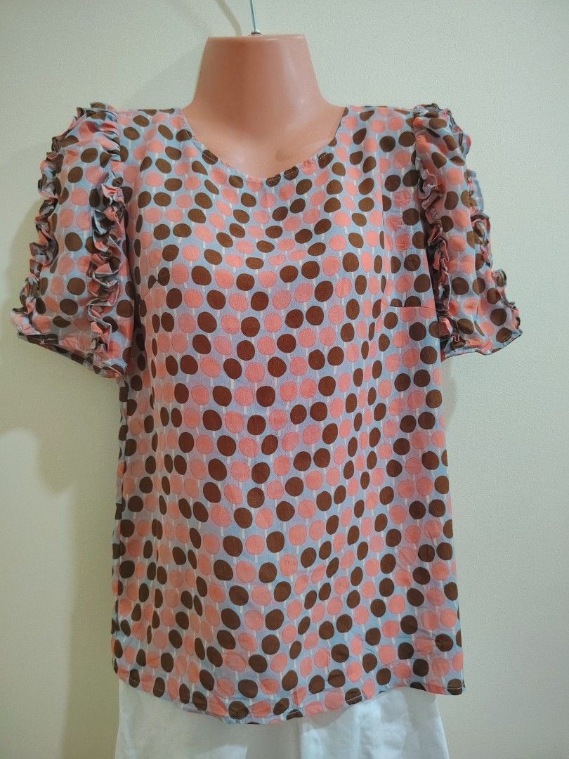 Short Sleeve Ruffle Blouse Polka Dot Pattern (Category: Blouses) located in Quezon City. Submitted by timelesstreasure117 (Listing ID 1465550391, Image 1). Description: Can fit from small to medium Good condition but missing button at the back.. Easily replaced. 🙂 ₱70 Bundle with my other top listings to get discount 5 for ₱300 10 for ₱500 Buyer books courier of choice Payment via gcash or paymaya.