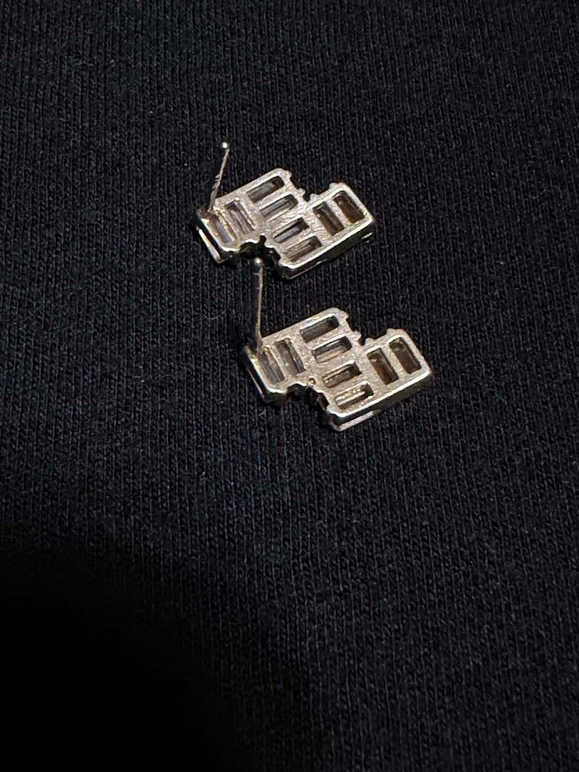 Silver 925 Geometric Baguette Crystal Stud Earrings (Category: Earrings) located in Abucay. Submitted by thrifty.picked (Listing ID 1465526293, Image 2). Description: - Design: Geometric stepped zig-zag style - Stones: Baguette-cut crystals with amazing sparkle no pakaw but can provide silicone lock - Material: Silver 925metal - Closure: Secure back posts - Condition: Ready to wear.
