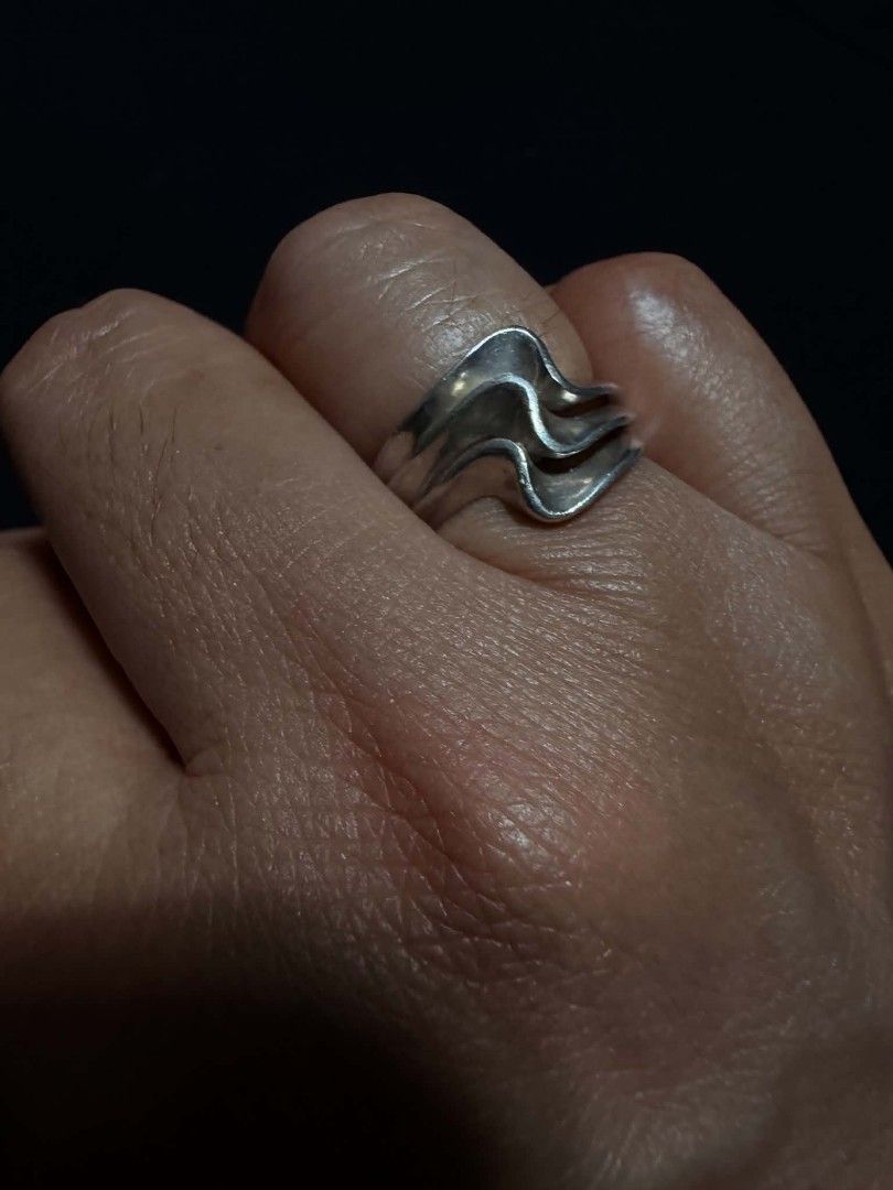 Silver 925 Wavy Multi-Band Statement Ring (Category: Rings) located in Abucay. Submitted by thrifty.picked (Listing ID 1465526557, Image 1). Description: - Style: Chunky statement ring with a flowing, wavy triple-band design - Material: Polished silver 925metal - Fit: Sits comfortably across the finger - Usage: Perfect everyday accessory to add texture to your hand stack - Condition: Minimal signs of wear from previous use.