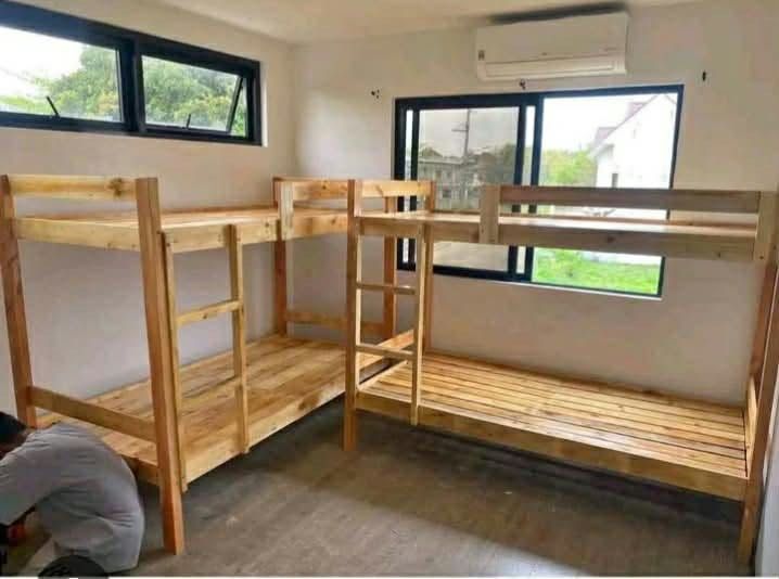 Single Palochina Wood Double Deck (Category: Bed Frames & Mattresses) located in Manila. Submitted by marquezpa52205 (Listing ID 1465407953, Image 2). Description: - Solid wooden bunk bed frame in a natural wood finish - Built-in ladder on the right side - Slat base design included for both top and lower decks - Sturdy and durable construction, fits standard mattresses - Ideal for bedrooms, guest rooms, or dorm spaces - Note: Disassembly required