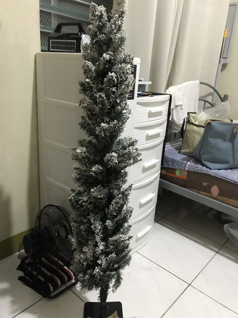 Slim small xmas tree (Category: Other Home Decor) located in Balete No 2. Submitted by troyesybang (Listing ID 1465482095, Image 1). Description: Small Christmas tree For corner or gardens corner Detachable two parts with metal stand provided Comes wid box Approx 3ft hanggang bewang adult size Tree only wid box no decor lights included.