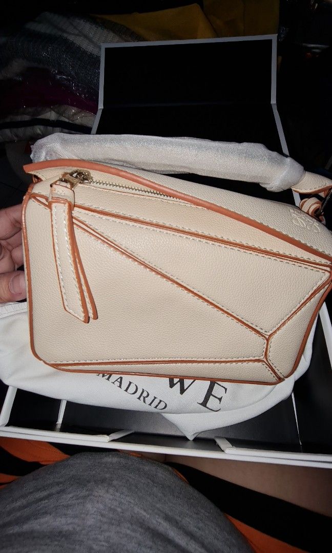 Small Puzzle Bag (Category: Shoulder Bags) located in Quezon City. Submitted by missmaui (Listing ID 1465459819, Image 1). Description: Complete inclusion Brand new can fit Iphone promax.