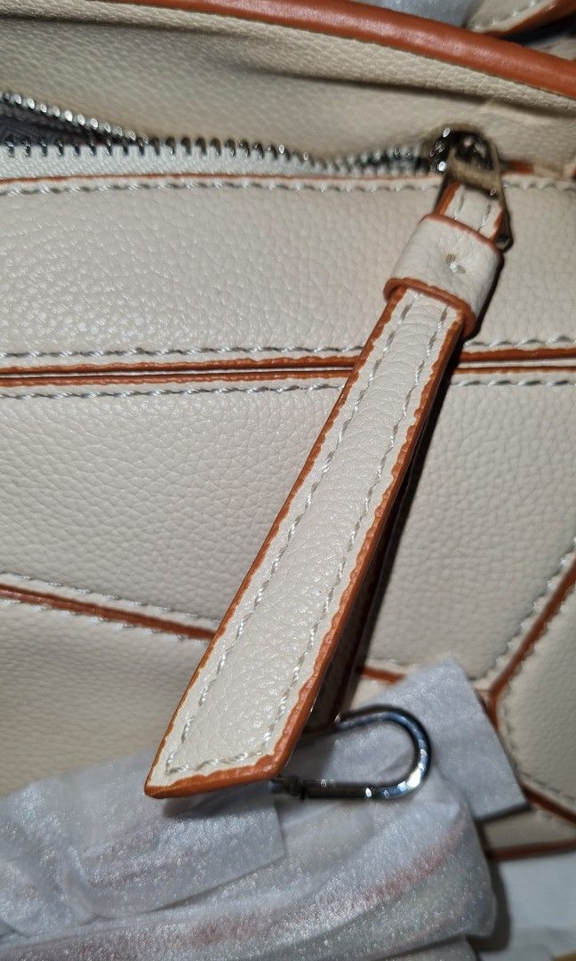 Small Puzzle Bag (Category: Shoulder Bags) located in Quezon City. Submitted by missmaui (Listing ID 1465459819, Image 3). Description: Complete inclusion Brand new can fit Iphone promax.