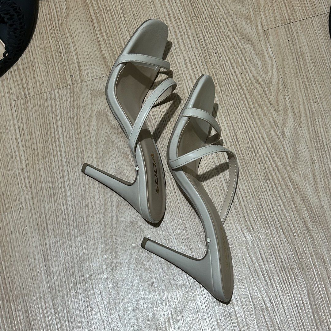 SODA Cream Strappy Stiletto Heels (Category: Heels) located in Dasmarinas. Submitted by lunabobbie (Listing ID 1465479536, Image 2). Description: - Brand: SODA - Style: Slim strappy slip-on heels with high stiletto heels and open square toe - Color: Neutral beige (versatile and easy to match) - Condition: Minimal wear, very clean insoles and soles - Perfect for: Casual outings, dates, and formal events.