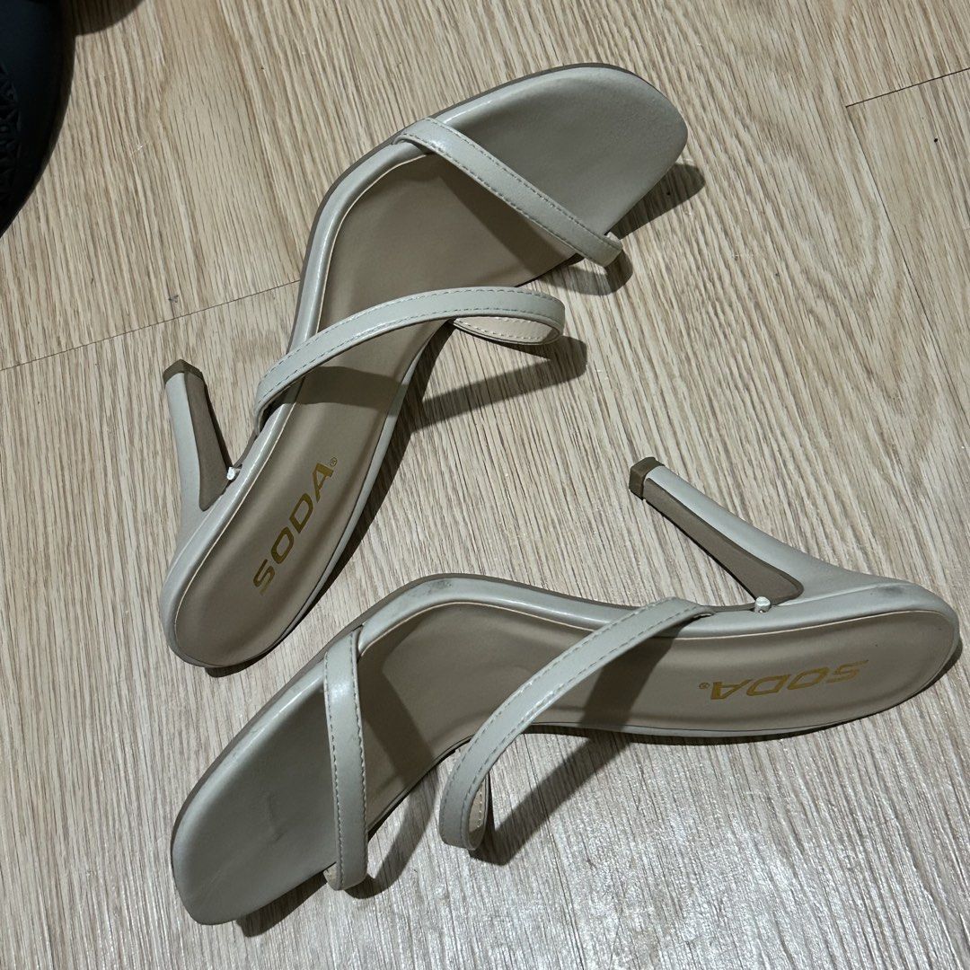 SODA Cream Strappy Stiletto Heels (Category: Heels) located in Dasmarinas. Submitted by lunabobbie (Listing ID 1465479536, Image 3). Description: - Brand: SODA - Style: Slim strappy slip-on heels with high stiletto heels and open square toe - Color: Neutral beige (versatile and easy to match) - Condition: Minimal wear, very clean insoles and soles - Perfect for: Casual outings, dates, and formal events.