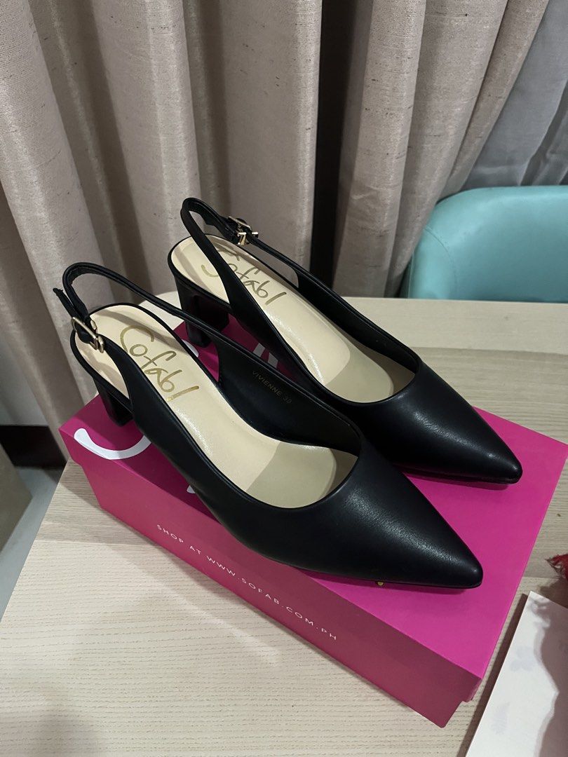Sofab Black Vivienne Heels Size 39 (Category: Heels) located in Mandaue City. Submitted by zinniaxclaire (Listing ID 1465540823, Image 2). Description: - Brand: Sofab - Style: Vivienne slingback heels with chunky block heel and pointed toe - Color: Black - Size: 39 - Details: Adjustable ankle strap with gold-tone buckle - Inclusions: Original pink branded shoebox, protective dust wrapping, and retail tag (1,499 PHP) - used during graduation rites