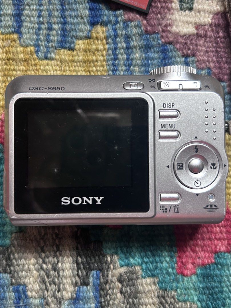 Sony Cyber-shot DSC-S650 7.2MP Digital Camera (Category: Cameras) located in Pandi. Submitted by demmyyy (Listing ID 1465519428, Image 3). Description: Camera Details: • 7.2 Megapixels • 3x Optical Zoom • Condition: 100% No functional issues. Crisp Outputs, Flash, zoom, and all buttons are working perfectly. • Cosmetic Condition: 8.5/10 (few minor scratches but barely visible & 2 white dots on screen not affecting the outputs) Inclusions: • Camer
