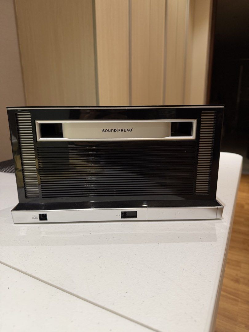 Soundfreaq Sound Rise Speaker System (Category: Soundbars, Speakers & Amplifiers) located in Quezon City. Submitted by zyllus30 (Listing ID 1465494384, Image 3). Description: - Brand: Soundfreaq Wireless Speaker - Color: Sleek black with silver accents - Controls: Physical top knobs for volume, bass, and treble - Included: Dedicated remote control - Ports: DC power input and AUX port - Condition: Clean, excellent working condition for home audio 