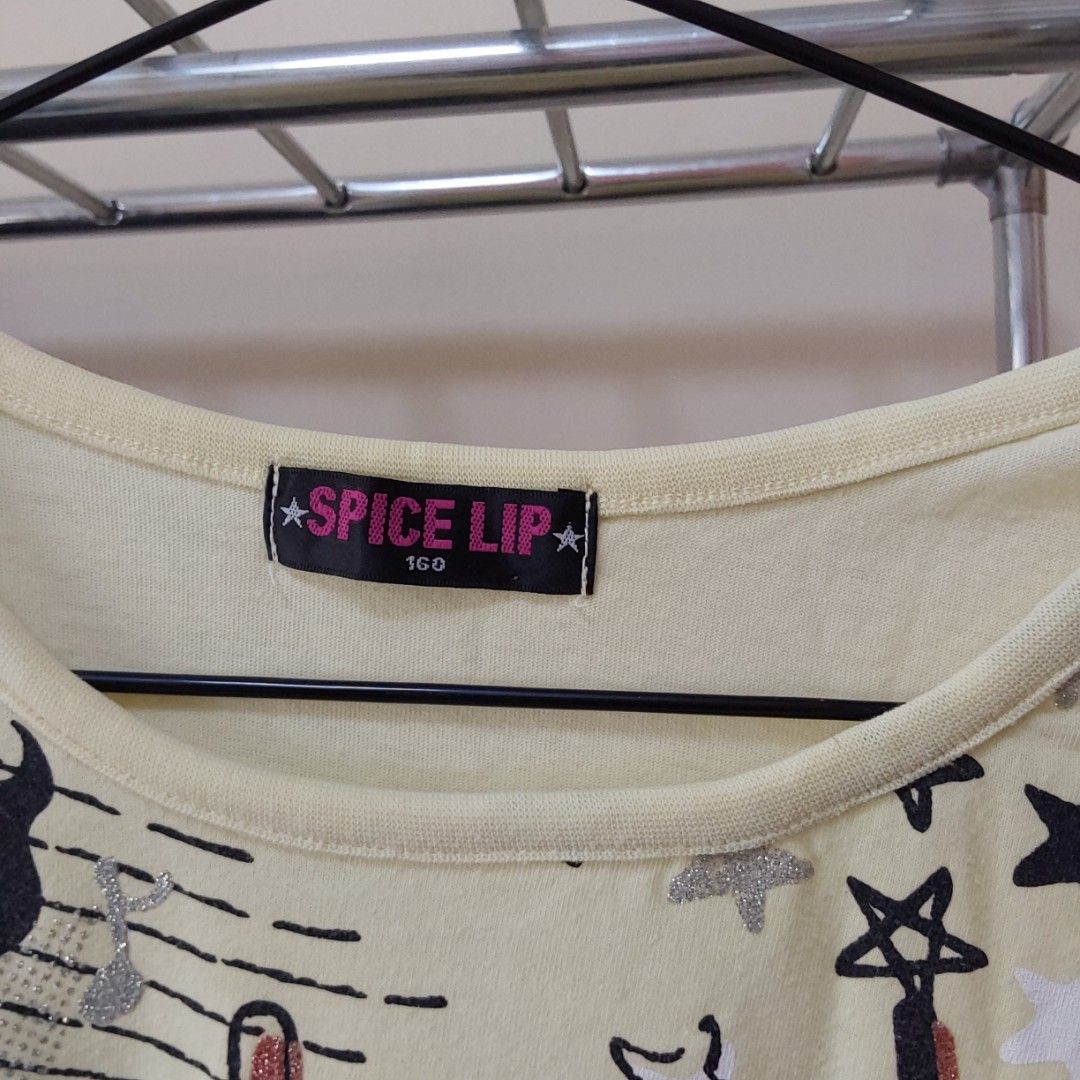 [Spice lip] Light yellow graphic tee (Category: Shirts) located in Magarao. Submitted by cinabonthrifts (Listing ID 1465444703, Image 2). Description: Size: s-m MOP: Gcash MOD: Jnt Dm for more inquiries!.