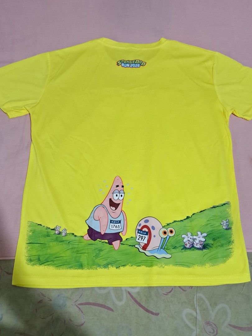 Spongebob Run — Race Shirt (Category: Activewear) located in Quezon City. Submitted by sapphiredreams_ (Listing ID 1465444885, Image 2). Description: Decluttering Sale: Spongebob Run 2026 Set — ₽1,000 ✓ Race Shirt (Large) - 2pcs (₽550/pc) • Used during the race only. Still in good condition. Shipping Fee c/o Buyer. Courier: Grab, Lalamove, Angkas Padala, LBC MOP: Gcash / BDO Location: QC.