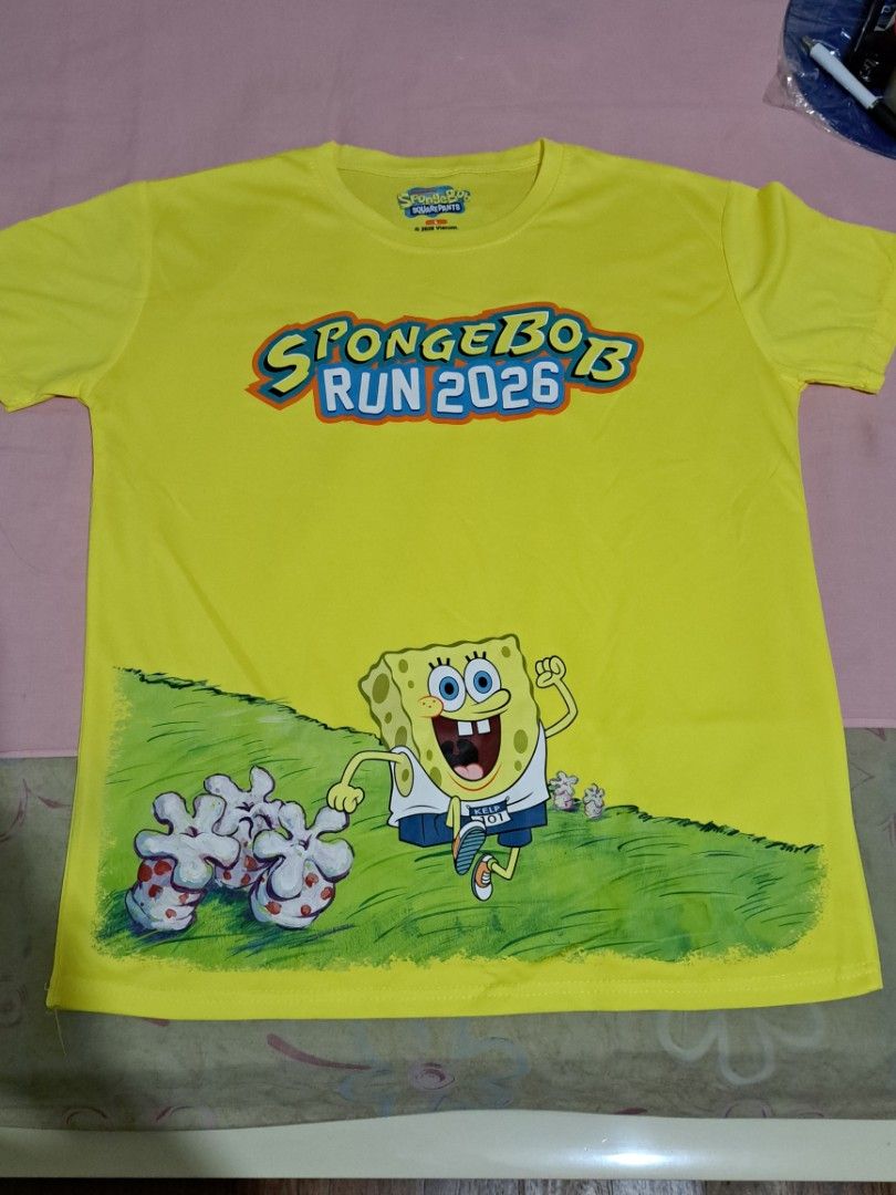 Spongebob Run — Race Shirt (Category: Activewear) located in Quezon City. Submitted by sapphiredreams_ (Listing ID 1465444885, Image 1). Description: Decluttering Sale: Spongebob Run 2026 Set — ₽1,000 ✓ Race Shirt (Large) - 2pcs (₽550/pc) • Used during the race only. Still in good condition. Shipping Fee c/o Buyer. Courier: Grab, Lalamove, Angkas Padala, LBC MOP: Gcash / BDO Location: QC.