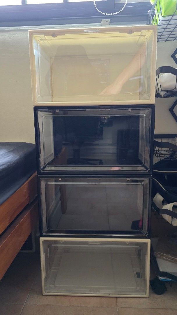 Stackable Clear Front Shoe Storage Box (Category: Storage Boxes & Baskets) located in Singapore. Submitted by the_yeet_shop (Listing ID 1465436621, Image 2). Description: Clear drop-front shoe box with a cream frame. Measures about 12 inches wide based on the ruler in the photos. Stackable design to keep your kicks organized and dust-free. Sturdy plastic construction with a magnetic or snap-closure door. Fits standard sneakers and high-tops easil