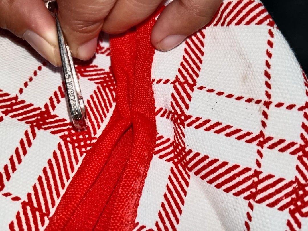 Starbucks Red Plaid Summer Carrier Bag (Category: Tote Bags) located in Santo Tomas. Submitted by noviemolde07815 (Listing ID 1465403989, Image 3). Description: - Authentic Starbucks summer collection carrier bag - Trendy red and white plaid pattern with bold black STARBUCKS lettering - Includes a detachable/attached metal Siren logo pin on the side - Vibrant bright orange interior lining complete with convenient pockets and official tag - Secure