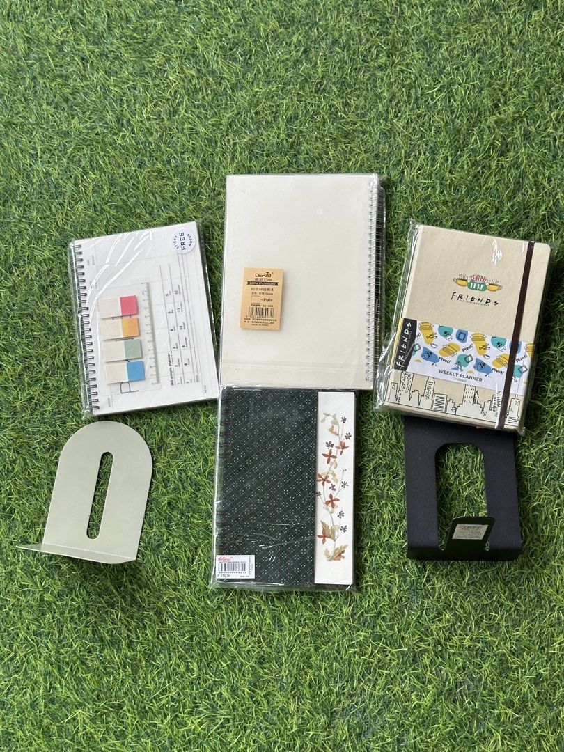Stationery Bundle Planners Notebooks Bookends and Sticky Notes (Category: Stationery & School Supplies) located in Meycauayan. Submitted by stld027 (Listing ID 1465448918, Image 1). Description: TAKE ALL FOR 300 - Brand new, sealed stationery and desk organization bundle - Friends weekly planner - Depai plain B5 notebook - National Book Store batik planner with real pressed flowers - Desktop calendar paired with gradient sticky notes - Set of 2 m