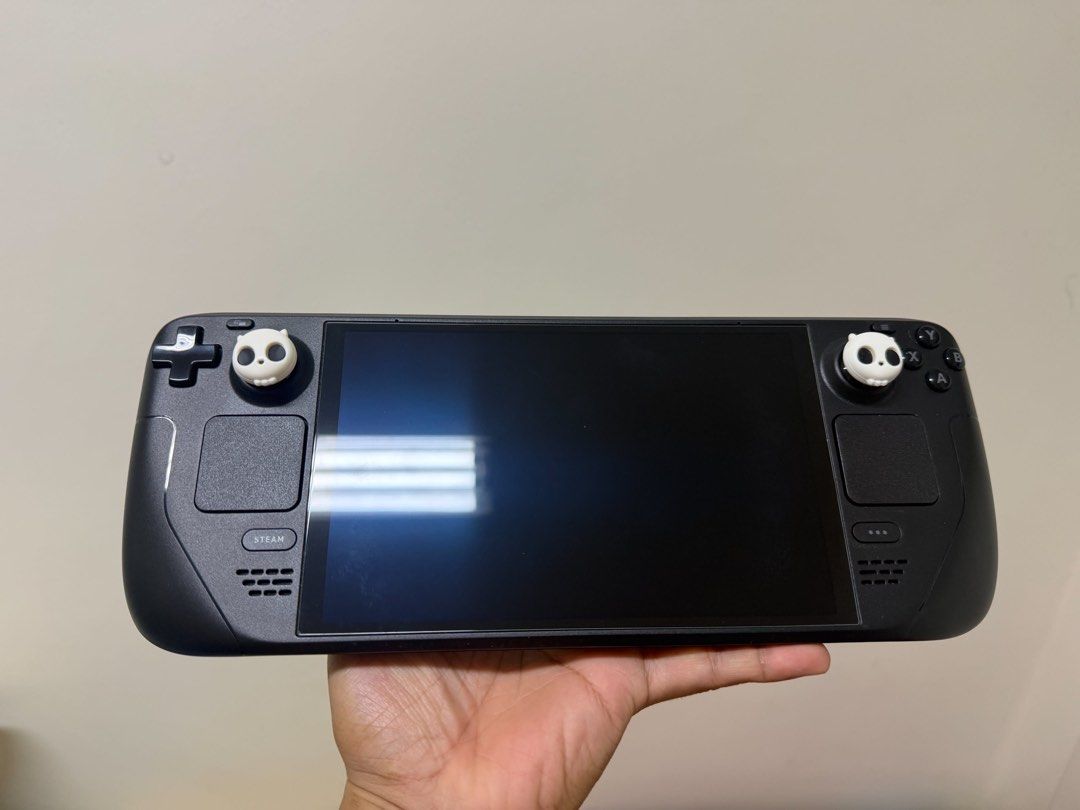 Steam Deck OLED 512GB (Category: PlayStation) located in Manila. Submitted by isavibes (Listing ID 1465445355, Image 1). Description: Selling some of my partner's pre-loved gaming items. All items are well taken care of and in good condition. Actual photos posted. 🎮 STEAM DECK OLED 512GB * Rarely used * 100% Battery Health * No dents * No known issues * Complete box * With original receipt from DataBlitz * Well maintained // Can opt to buy its s