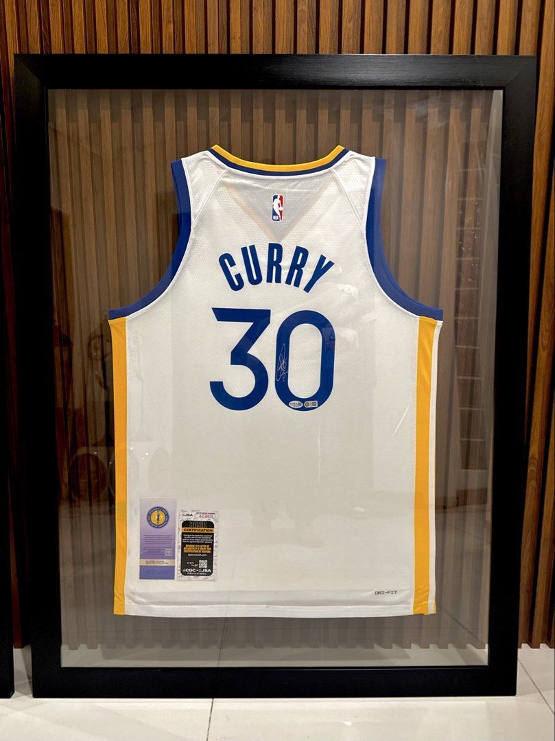 Stephen Curry Signed Nike Swingman Jersey (Category: Activewear) located in Manila. Submitted by beaudgsp (Listing ID 1465390564, Image 1). Description: Stephen Curry Signed Nike Swingman White Jersey Professionally framed and displayed behind glass 100% certified by JSA with authentication hologram AZ34058 Includes original USA Sports Marketing tags Rare collector's item for NBA fans and memorabilia enthusiasts Meet-ups or shipping options avail