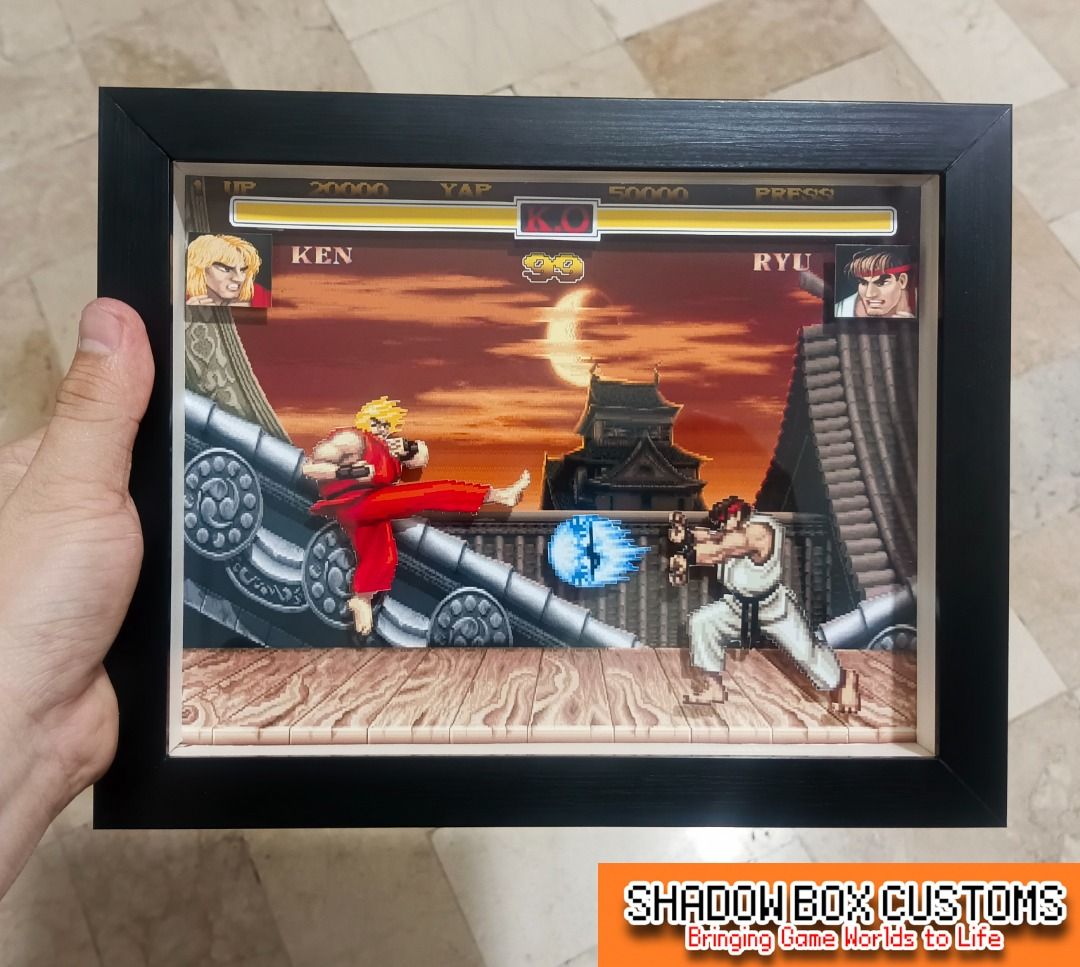 Street Fighter 2 Video Game Shadow Box - Ken vs Ryu (Category: Nintendo) located in Quezon City. Submitted by natzuki10 (Listing ID 1465397048, Image 1). Description: Street Fighter 2 Video Game Shadow Box - Ken vs Ryu Height: 8 inches Width: 10 inches *Handmade Pixel Shadow Boxes *Accepting Customized Designs *Perfect for Gamers & Collectors #videogames #nintendo #playstation #roomdecor #collection #gamer #gift.