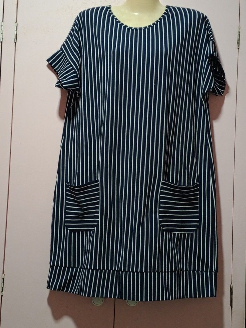Stripe blue dress (Category: Dresses) located in Bacolod City. Submitted by yannamarie (Listing ID 1465450969, Image 2). Description: - Navy blue dress with chic vertical white stripes - Comfortable round neckline and cute short ruffled sleeves - Features 2 convenient front pockets with horizontal stripe detail - Relaxed fit, perfect for everyday casual wear - Size: Fits Large up to 2XL.