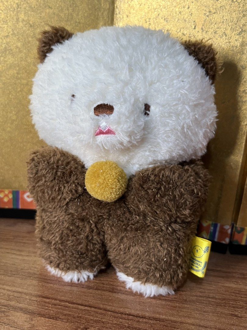 Sun Lemon Fluffy Tatton Sea Otter Plush (Category: Plushies & Soft Toys) located in Gapan. Submitted by lunashop14 (Listing ID 1465562591, Image 2). Description: - Brand: Sunlemon Original (Designed in Tokyo) - Condition: Brand new / Excellent - Design: Fluffy brown and white fur with a detailed embroidered face and tiny pink tongue - Special Feature: Holding a small round yellow ball - Authenticity: Comes with the official yellow fabric tag on t