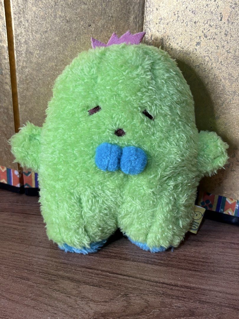 Sunlemon Fluffy Tatton Cactus Plush (Category: Plushies & Soft Toys) located in Gapan. Submitted by lunashop14 (Listing ID 1465562654, Image 2). Description: - Authentic Sunlemon Original green cactus plush - Features cute closed eyes and brown nose embroidery - Adorable tiny blue hands and feet with purple spikes - Soft, fuzzy, and clean fabric throughout - Original yellow tag attached with brand logo and text.