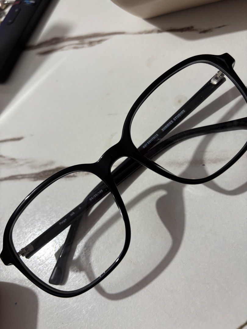 Sunnies Studios Paige Ink Eyeglasses Frames (Category: Sunglasses & Eyewear) located in Cainta. Submitted by _arianaventi (Listing ID 1465523398, Image 1). Description: - Brand: Sunnies Studios - Model: Paige Ink (G01SS1176CS) - Color/Material: Black acetate - Shape: Rounded - Measurements: 54-20-146 - Condition: Clean design, classic style - Usage: Suitable for everyday wear or prescription lenses.
