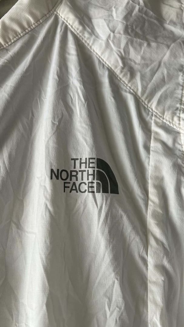 The North Face White Sleeveless Vest Jacket (Category: Vests) located in General Santos City (Dadiangas). Submitted by moana_thrifts (Listing ID 1463991138, Image 3). Description: - White sleeveless vest from The North Face - Lightweight material, ideal for layering - Features zippered pockets on the front - Mesh paneling on the back for enhanced breathability - Versatile for outdoor activities or everyday casual wear.