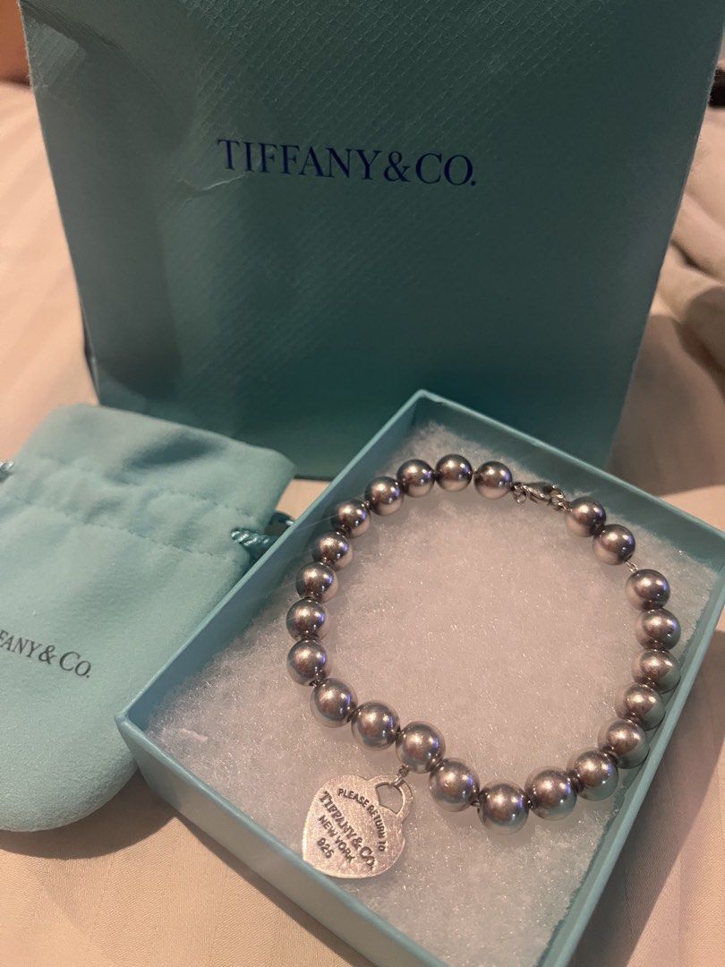 Tiffany & Co. Bead Bracelet (Category: Bracelets) located in Mandaluyong City. Submitted by ryshe (Listing ID 1465506519, Image 1). Description: - Authentic Tiffany & Co. Sterling Silver Bead Bracelet - Features the classic Return to Tiffany engraved heart tag (925) - Like New , ready to gift or wear - Comes complete with original blue box, dust pouch, and paper gift bag - With original receipt from the US (bought in beverly hills).