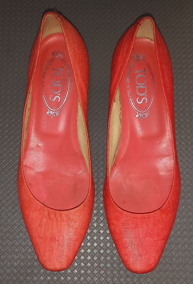 Tod's Red Orange Kitten Heel Pumps Size 36.5 (Category: Heels) located in Cagayan de Oro. Submitted by edwardryan01984 (Listing ID 1465400900, Image 2). Description: - Brand: Tod's - Color: Red - Size: 36.5 (Made in Italy) - Style: Slip-on kitten heels with low heel for all-day comfort - Condition: Exterior is clean and vibrant; minor signs of wear on the inner sole - Details: Classic Tod's branding stamped inside the insole.