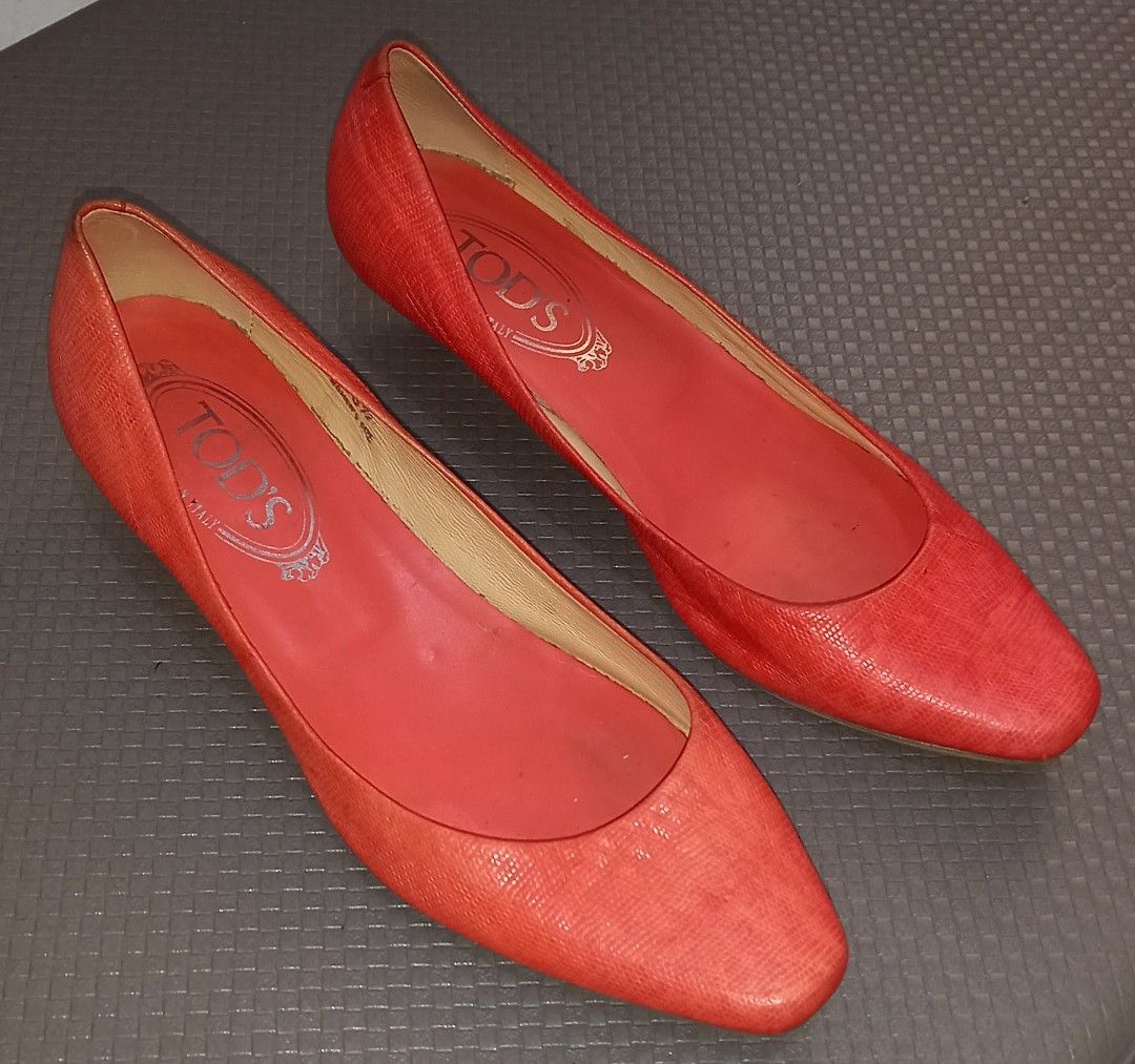 Tod's Red Orange Kitten Heel Pumps Size 36.5 (Category: Heels) located in Cagayan de Oro. Submitted by edwardryan01984 (Listing ID 1465400900, Image 1). Description: - Brand: Tod's - Color: Red - Size: 36.5 (Made in Italy) - Style: Slip-on kitten heels with low heel for all-day comfort - Condition: Exterior is clean and vibrant; minor signs of wear on the inner sole - Details: Classic Tod's branding stamped inside the insole.