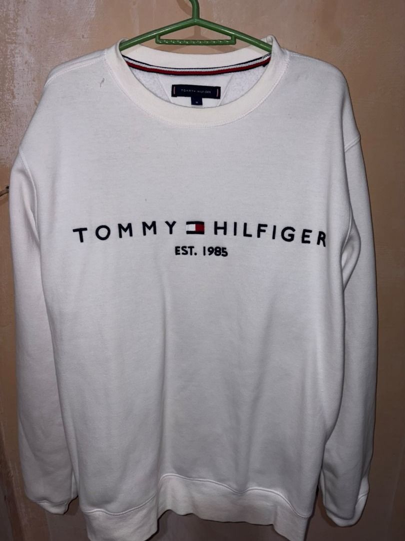 Tommy Hilfiger Est. 1985 White Sweatshirt (Category: Coats, Jackets and Outerwear) located in Caloocan City. Submitted by ramenonly (Listing ID 1465406093, Image 1). Description: ‼ DECLUTTERING SALE ‼ ‼ PRE LOVED ‼ Tommy Hilfiger Est. 1985 White Sweatshirt Medium Needs Wash Yellow Stain visibile but washable .