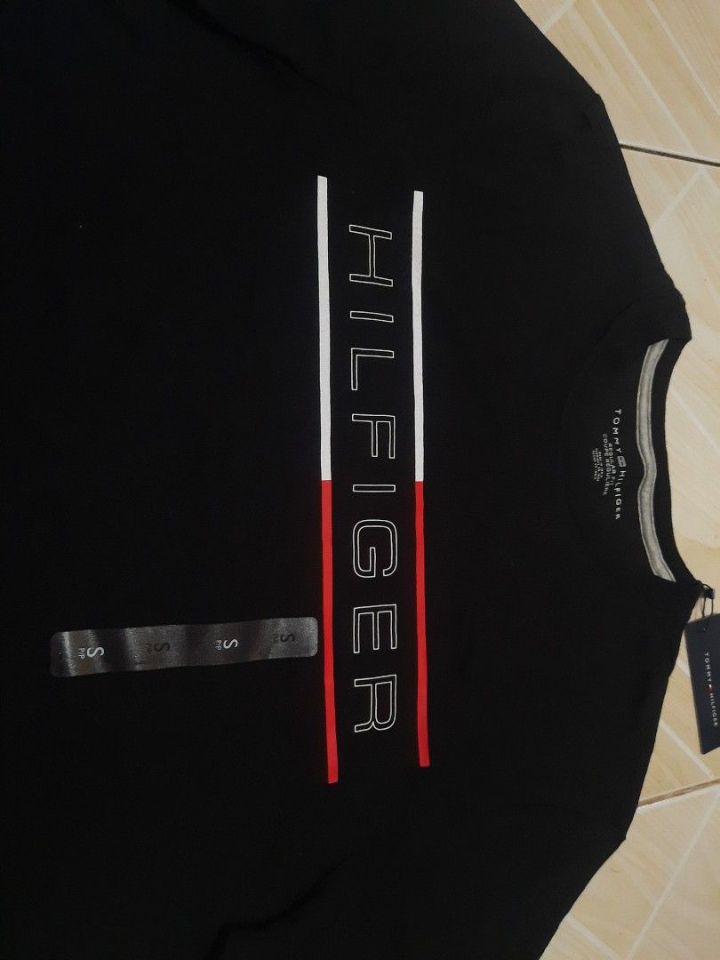 tommy hilfiger logo print tee (authentic) (Category: Tshirts & Polo Shirts ) located in Tarlac. Submitted by thryftstash (Listing ID 1465405020, Image 3). Description: dimes: 27.5 - 19 S on tag issue: none sf not included tarlac loc j&t and lbc courier.