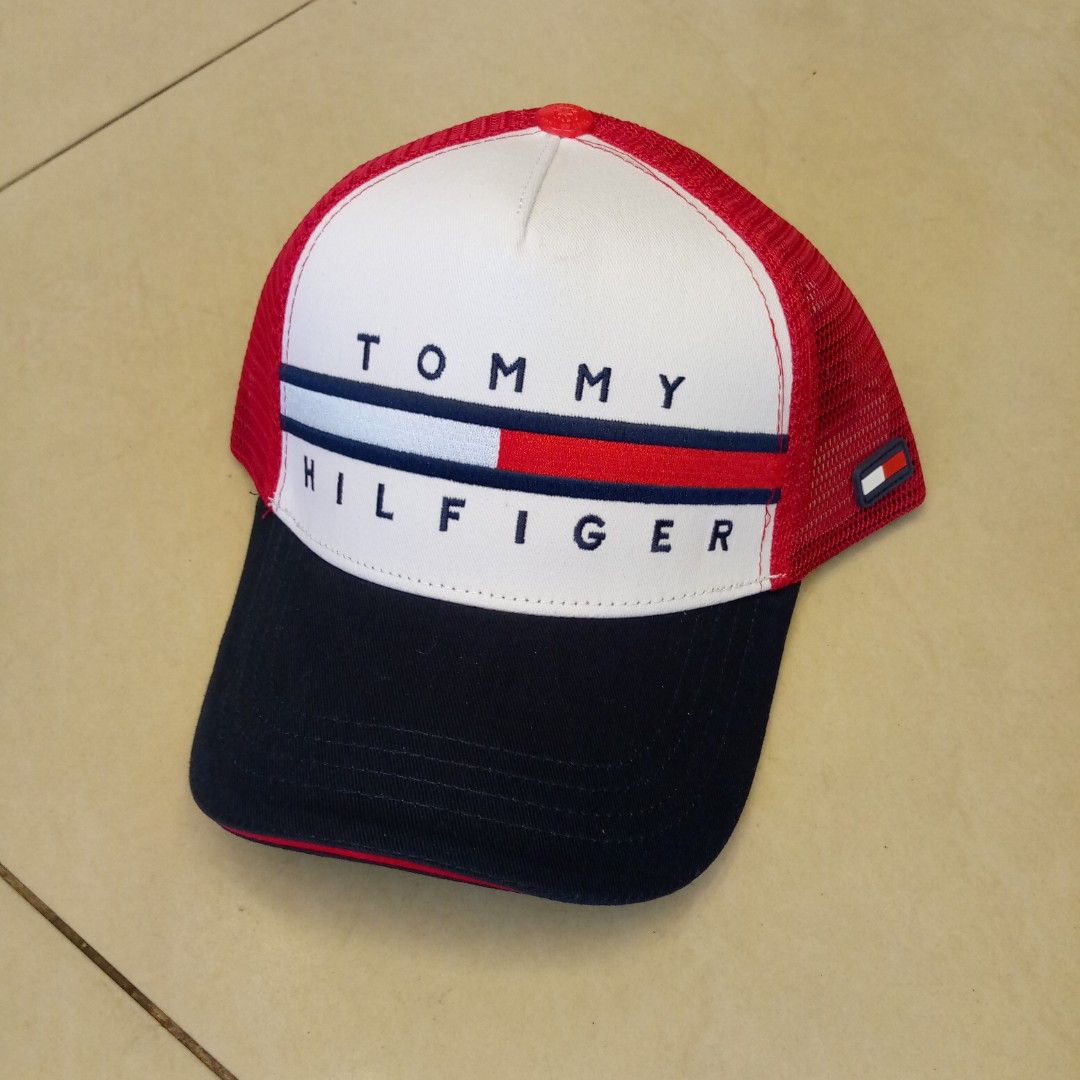 Tommy Hilfiger Trucker Cap Red White Blue (Category: Caps & Hats) located in Manila. Submitted by pablopresk0. (Listing ID 1465503185, Image 1). Description: - Brand: Tommy Hilfiger - Design: Classic tricolor (red, white, and navy blue) with embroidered flag logo on the front - Comfort: Breathable mesh backing and interior branded taping - Fit: Adjustable snapback closure for a custom fit - Condition: Clean brim and crisp stitching throughout - S