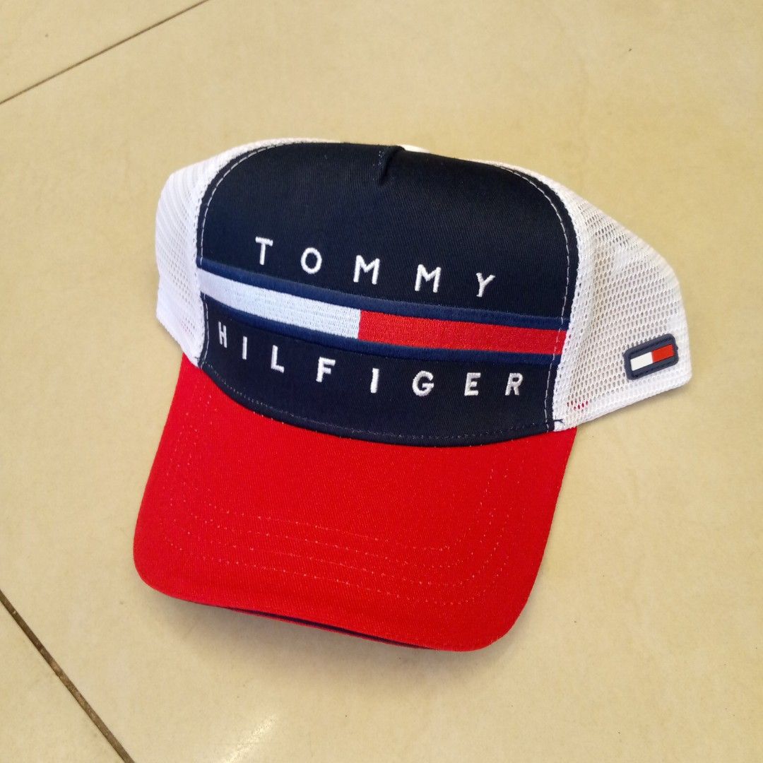 Tommy Hilfiger Trucker Hat Red White Blue (Category: Caps & Hats) located in Manila. Submitted by pablopresk0. (Listing ID 1465503649, Image 1). Description: - Brand: Tommy Hilfiger - Design: Classic colorblock in red, navy blue, and white with embroidered front branding - Comfort: Breathable mesh backing ideal for sunny days - Fit: Adjustable snapback closure for a custom fit - Details: Includes interior branded taping and original care tags Man
