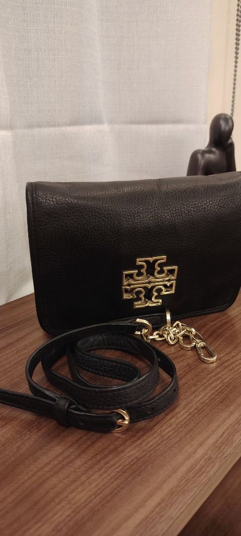 Tory Burch Black Leather Crossbody Bag (Category: Cross-body Bags) located in Caloocan City. Submitted by curatedbylez (Listing ID 1465478962, Image 3). Description: - Brand: Tory Burch - Material: Premium black pebble leather - Hardware: Gold-tone with prominent logo on the flap - Closure: Flap with magnetic snap - Strap: Adjustable leather shoulder strap with decorative chain detail - Interior: Multiple compartments and a zippered pocket with T