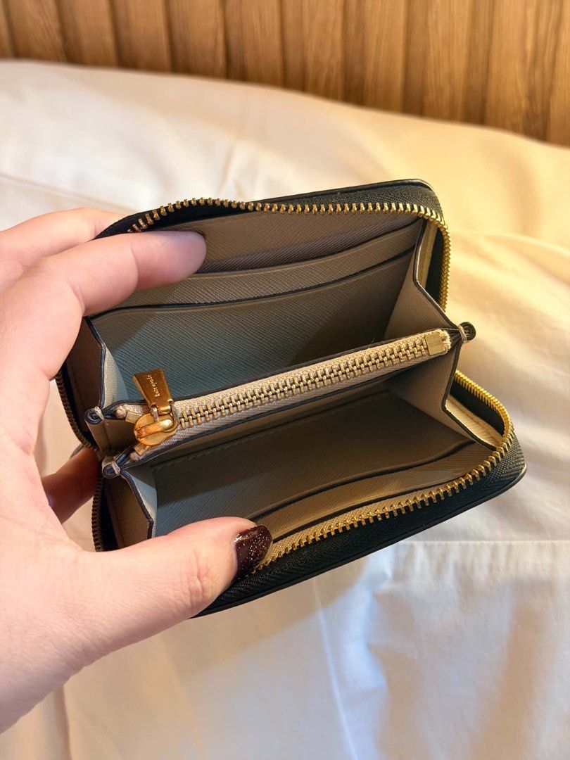 Tory Burch Black Quilted Leather Zip Around Wallet (Category: Luxury Bags & Wallets) located in Manila. Submitted by iamsassycl95926 (Listing ID 1465465519, Image 2). Description: - Brand: Tory Burch - Material: Black quilted leather with gold-tone hardware & iconic double T logo - Closure: Zip-around with leather pull tab - Interior: Light grey leather/fabric lining, multiple card slots, slip pockets, and central zippered coin compartment - Size