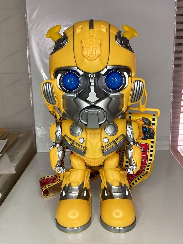 Transformers Bumblebee Popcorn Bucket with Strap (Category: Character Goods) located in Makati City. Submitted by gogokin (Listing ID 1465438204, Image 1). Description: - Official Transformers Bumblebee character popcorn bucket - Made of bright yellow and silver molded plastic - Features working glowing blue light-up eyes - Includes yellow carrying strap with movie imagery and film strip motifs - Brand new with original tag attached - Perfect fun