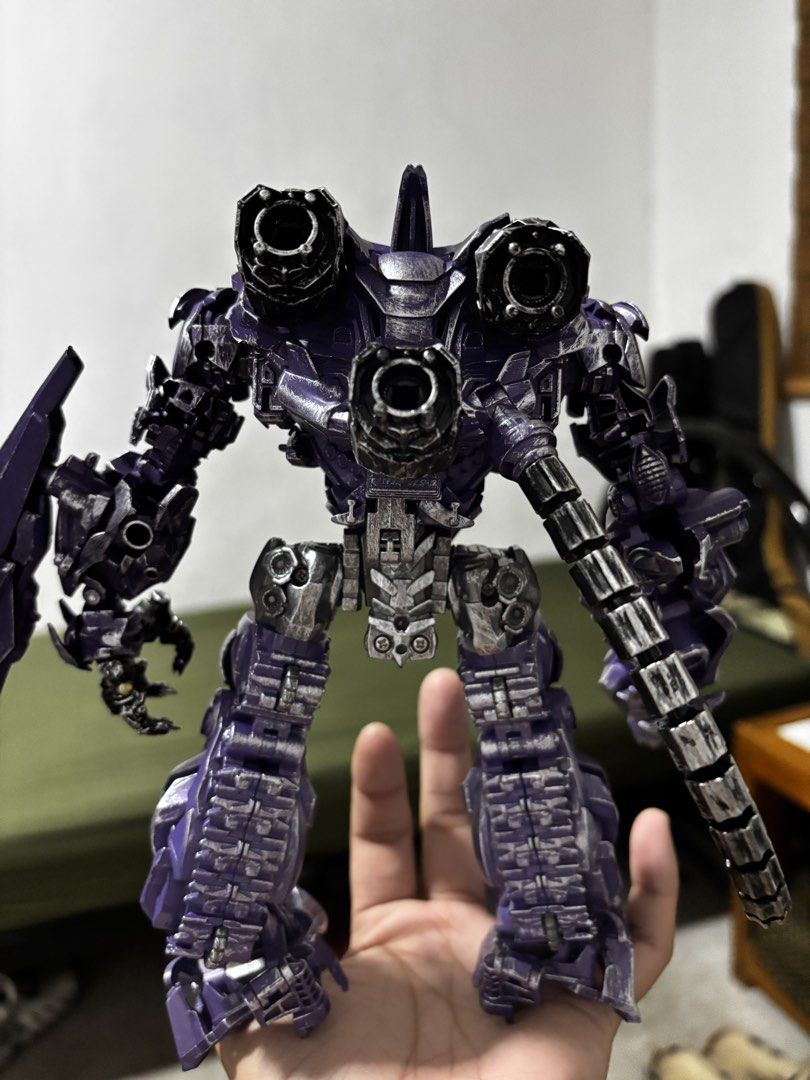 Transformers Shockwave Action Figure (Category: Action & Battle Toys) located in Manila. Submitted by elpiipiii (Listing ID 1465547072, Image 3). Description: - Transformers movie series Purple Shockwave figure - Detailed metallic paint finish with realistic battle damage effects - Includes a large fusion cannon with a flexible feed tube on the right arm - Articulated hands with individually jointed fingers - Sturdy build that stands well on its 