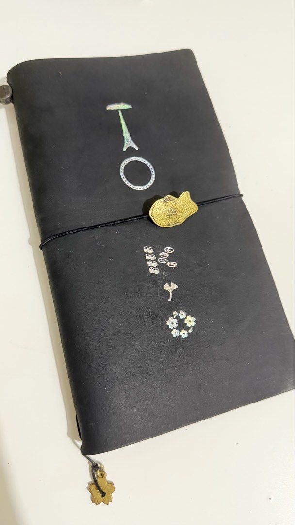 Traveler's Notebook Tokyo + Charms (Category: Stationery & School Supplies) located in Rizal. Submitted by artandjournals (Listing ID 1465514750, Image 1). Description: Traveler’s Notebook Regular Size Will come with box and cloth pouch No inserts Will come with the charms in the photo that have patina Selling as a set This is unused, just on the shelf. Price: 9,000 Shipping cost by buyer J&T: Weekends only Lalamove/Grab: On available schedule, t