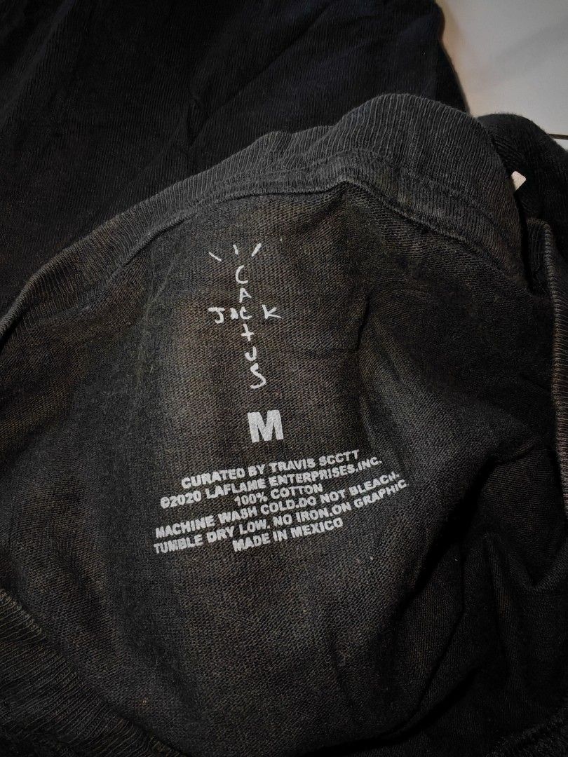 Travis Scott Cactus Jack PlayStation T-Shirt (Category: Tshirts & Polo Shirts ) located in Davao. Submitted by thrift2you (Listing ID 1465420913, Image 3). Description: - Item: Travis Scott Cactus Jack x PlayStation Tee - Color: Faded Black (washed look) - Size: Medium - Design: Large burning globe front graphic, PlayStation/Cactus Jack branding and 'Live in your world, RAGE in ours.' text on back - Material: 100% Cotton, Made in Mexico (© 2020 L