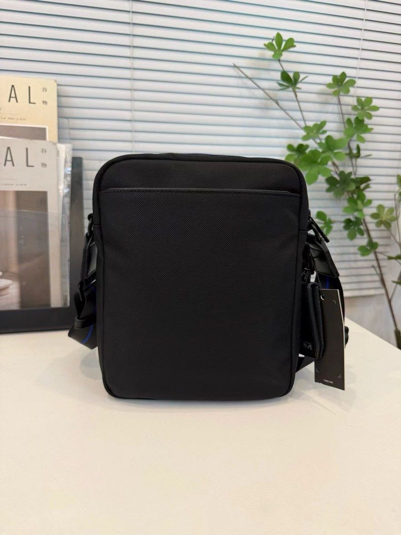 Tumi Alpha 4 Medium Crossbody (Category: Sling Bags) located in Manila. Submitted by bagmaniaph (Listing ID 1465535401, Image 2). Description: This shoulder bag features a slim square form and a vibrant line accent at the opening. Its exquisite size allows for neat storage of everyday small items, making daily travel look smart. The internal pockets and front zip design enable smooth organization and retrieval of valuables. The adjustable shoulde