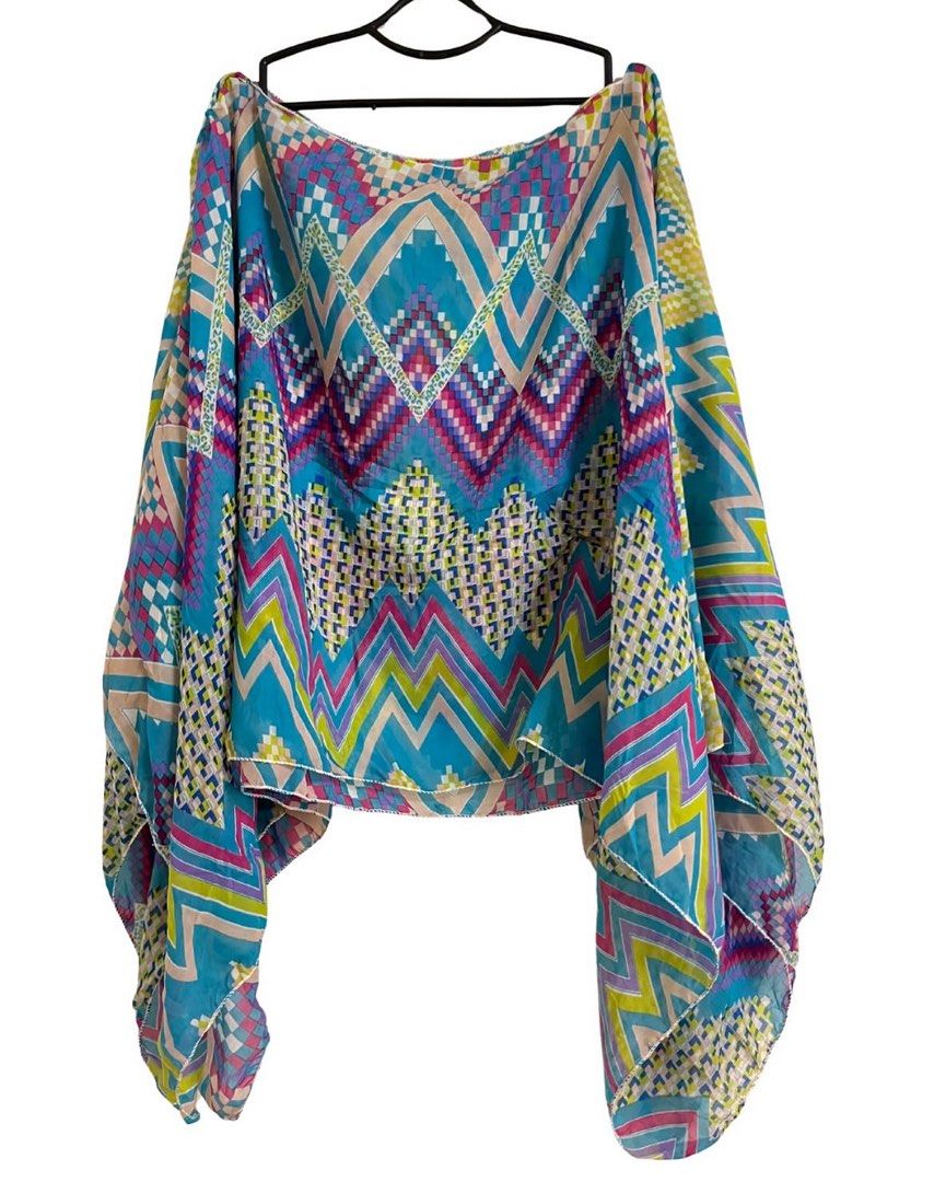 Ukay’ed Vintage Pieces (Category: Blouses) located in Bacolod City. Submitted by wisaaaaaa (Listing ID 1465526270, Image 1). Description: - Brand: Anne Klein - Size: 4P (Petite) - Color: Vibrant turquoise - Material: Silky satin with a smooth drape - Design: V-neck with a dramatic cascading center ruffle - Styling: Great for layering under blazers or wearing on its own.
