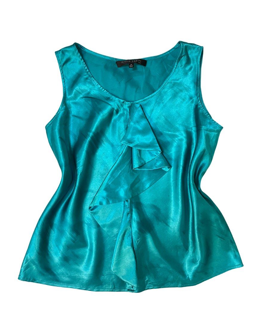Ukay’ed Vintage Pieces (Category: Blouses) located in Bacolod City. Submitted by wisaaaaaa (Listing ID 1465526270, Image 3). Description: - Brand: Anne Klein - Size: 4P (Petite) - Color: Vibrant turquoise - Material: Silky satin with a smooth drape - Design: V-neck with a dramatic cascading center ruffle - Styling: Great for layering under blazers or wearing on its own.