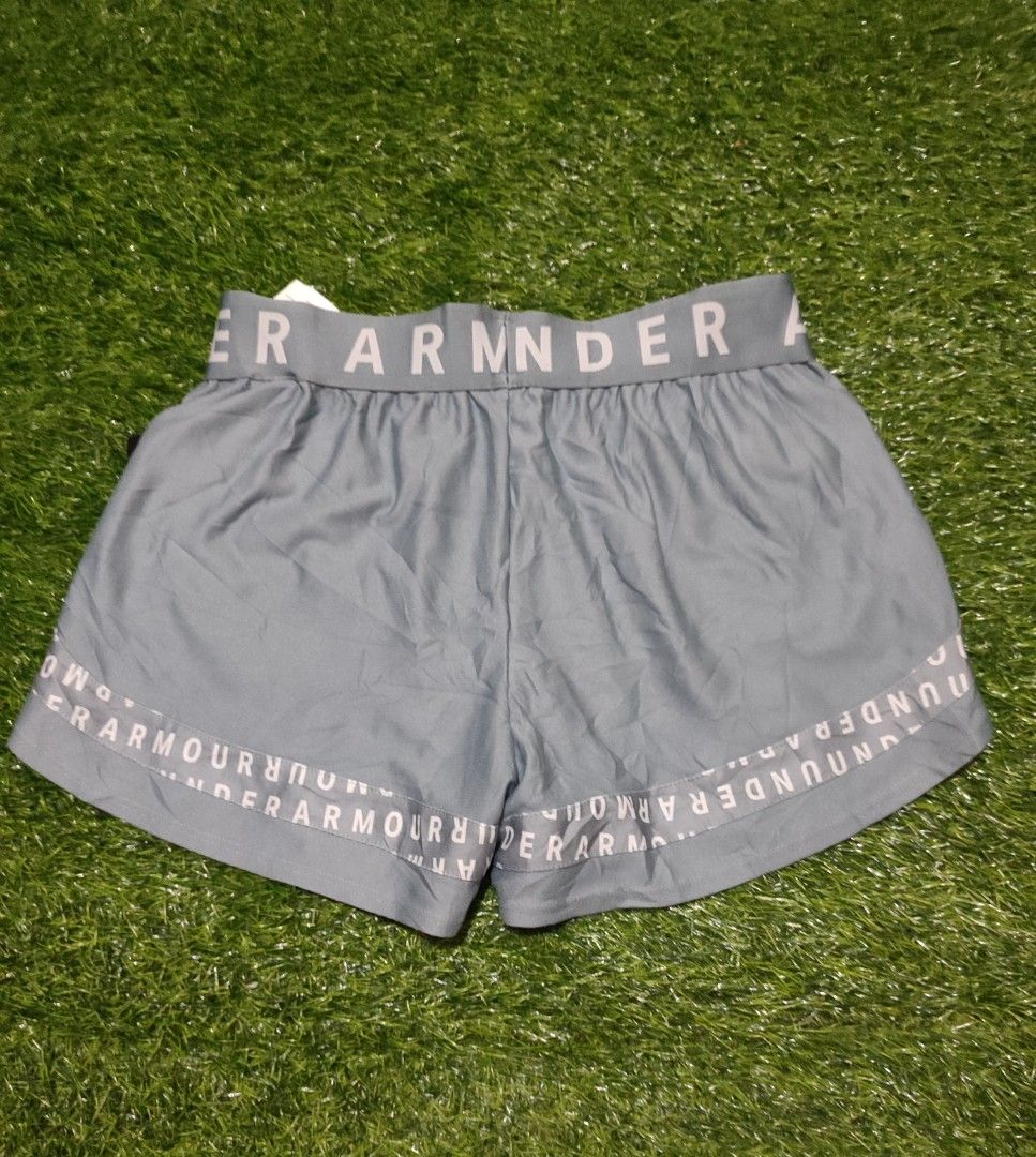 Under Armour Play Up 3.0 AOP Shorts (Category: Activewear) located in Cebu City. Submitted by deadjay84 (Listing ID 1465488106, Image 2). Description: - Under Armour Play Up 3.0 AOP Shorts - Color: Grey with all-over white text print - Size small on tag - Features: Wide branded elastic waistband, lightweight material - Condition: Brand new with original store tag attached - Perfect for: Working out, running, or casual lounging - Pls see photos fo