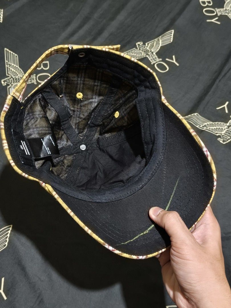 Undercontrol Yellow Plaid Cap UDC (Category: Caps & Hats) located in Cagayan de Oro. Submitted by epictiger_2a3d62 (Listing ID 1465412752, Image 2). Description: - Brand: Undercontrol - Design: Yellow plaid with white and maroon crisscross check pattern - Details: Embroidered brand text on the front panel and yellow ventilation eyelets - Closure: Adjustable strapback with a small UDC tag -Issue: with hole -Need wash.