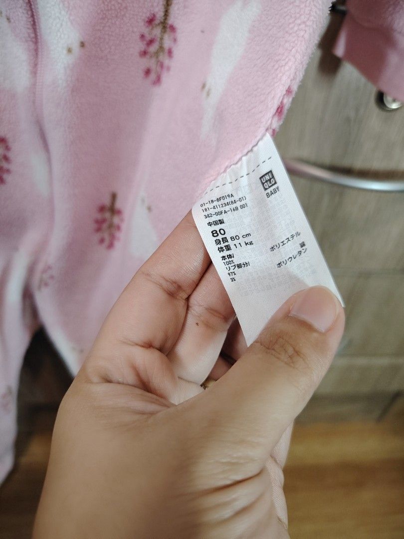Uniqlo Frogsuit (Size 80) (Category: Babies & Kids Fashion) located in Malabon City. Submitted by jessa.sioson (Listing ID 1465528442, Image 3). Description: - Color & Design: Soft pink with all-over white bunny and little tree pattern - Material: Cozy fleece, perfect for cold nights - Easy Changes: Full front zipper for hassle-free diaper changes - Safe & Warm: Built-in footies with non-slip polka dots on the soles - Comfort: Long sleeves for ex