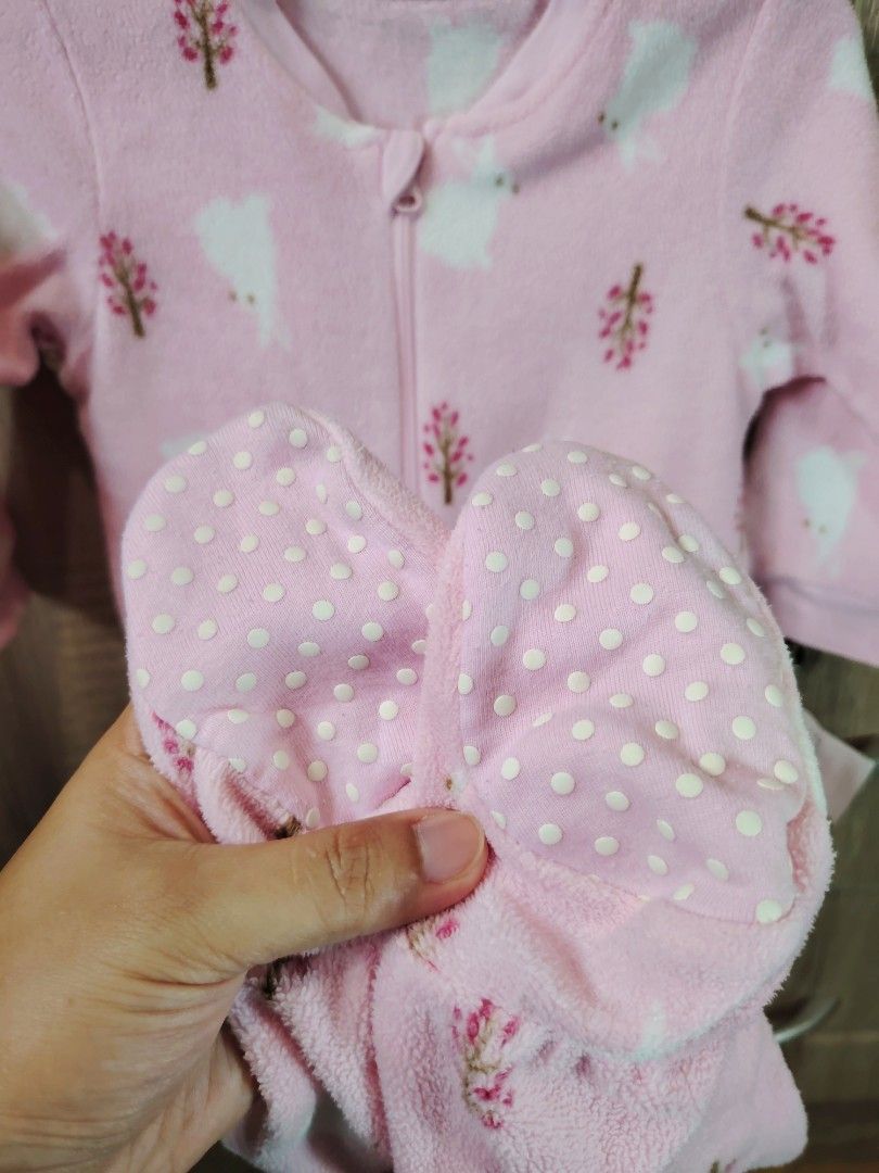 Uniqlo Frogsuit (Size 80) (Category: Babies & Kids Fashion) located in Malabon City. Submitted by jessa.sioson (Listing ID 1465528442, Image 2). Description: - Color & Design: Soft pink with all-over white bunny and little tree pattern - Material: Cozy fleece, perfect for cold nights - Easy Changes: Full front zipper for hassle-free diaper changes - Safe & Warm: Built-in footies with non-slip polka dots on the soles - Comfort: Long sleeves for ex