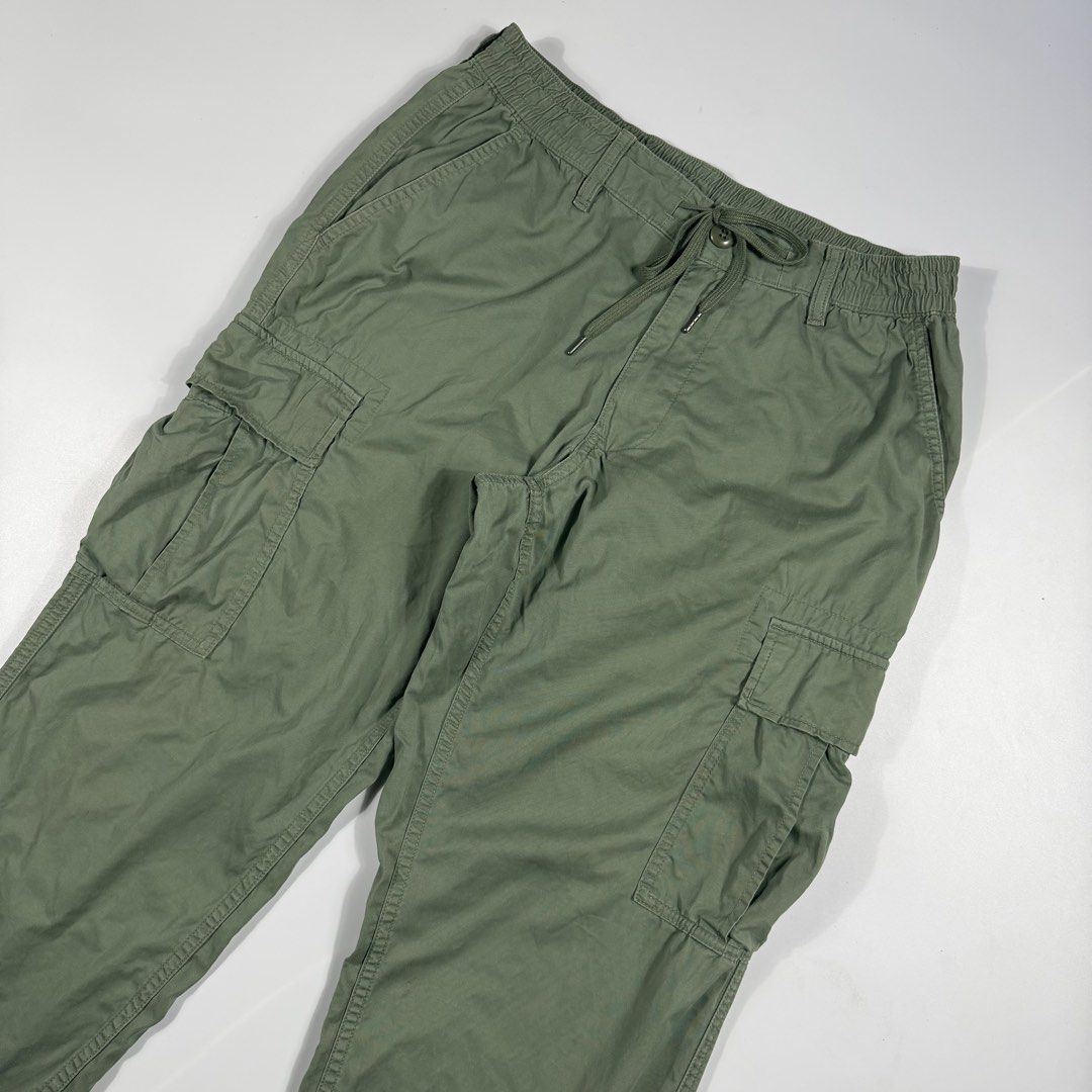 Uniqlo Olive Green Cargo Pants Size M (Category: Jeans) located in Bacolod City. Submitted by freshstuff13 (Listing ID 1465519224, Image 3). Description: - Brand: Uniqlo - Color: Olive green - Size: M (fits waist 76-84cm) - Material: Cotton and spandex blend with slight stretch - Waistband: Elastic with adjustable drawstring - Pockets: Multiple side and back pockets - Condition/Style: Great everyday utility trousers.