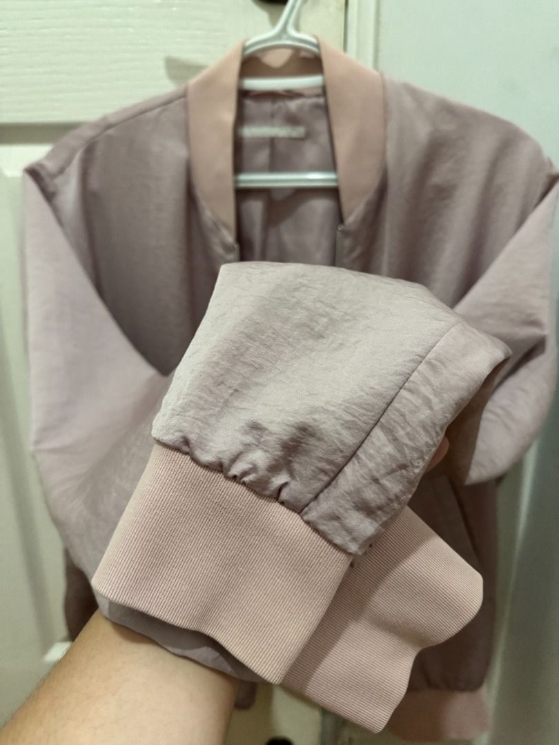 Uniqlo Soft Bomber Jacket | Pink | Size L (Category: Coats, Jackets and Outerwear) located in Makati City. Submitted by autumn.latte (Listing ID 1465514559, Image 3). Description: ♡ Perfect for chilly office/school days - Color: Dusty pink - Material: Smooth satin with soft lining - Closure: Full front zipper - Details: Ribbed knit collar, cuffs, and hem in lighter pink - Pockets: Two side pockets with slanted openings - Fit: Lightweight layer, i