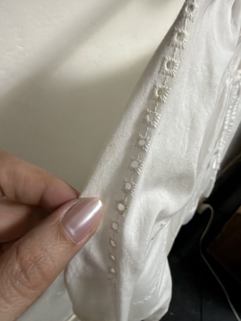 Uniqlo White Peasant Blouse Size S (Category: Blouses) located in Marikina City. Submitted by meandmyprelovedstuff (Listing ID 1465208880, Image 3). Description: - Brand: Uniqlo - Size: S (tag attached) - Color: White - Design: Square neckline with front tie, subtle eyelet embroidery stripes, and long sleeves with elastic cuffs - Fit: Smocked waist with a flattering flared peplum hem Fits S-M frames Color rate: 8/10 No issues Needs wash.